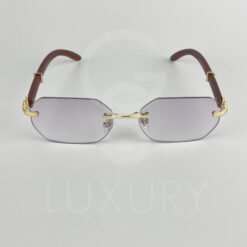 Lunette de soleil percé doré bras bois 64022