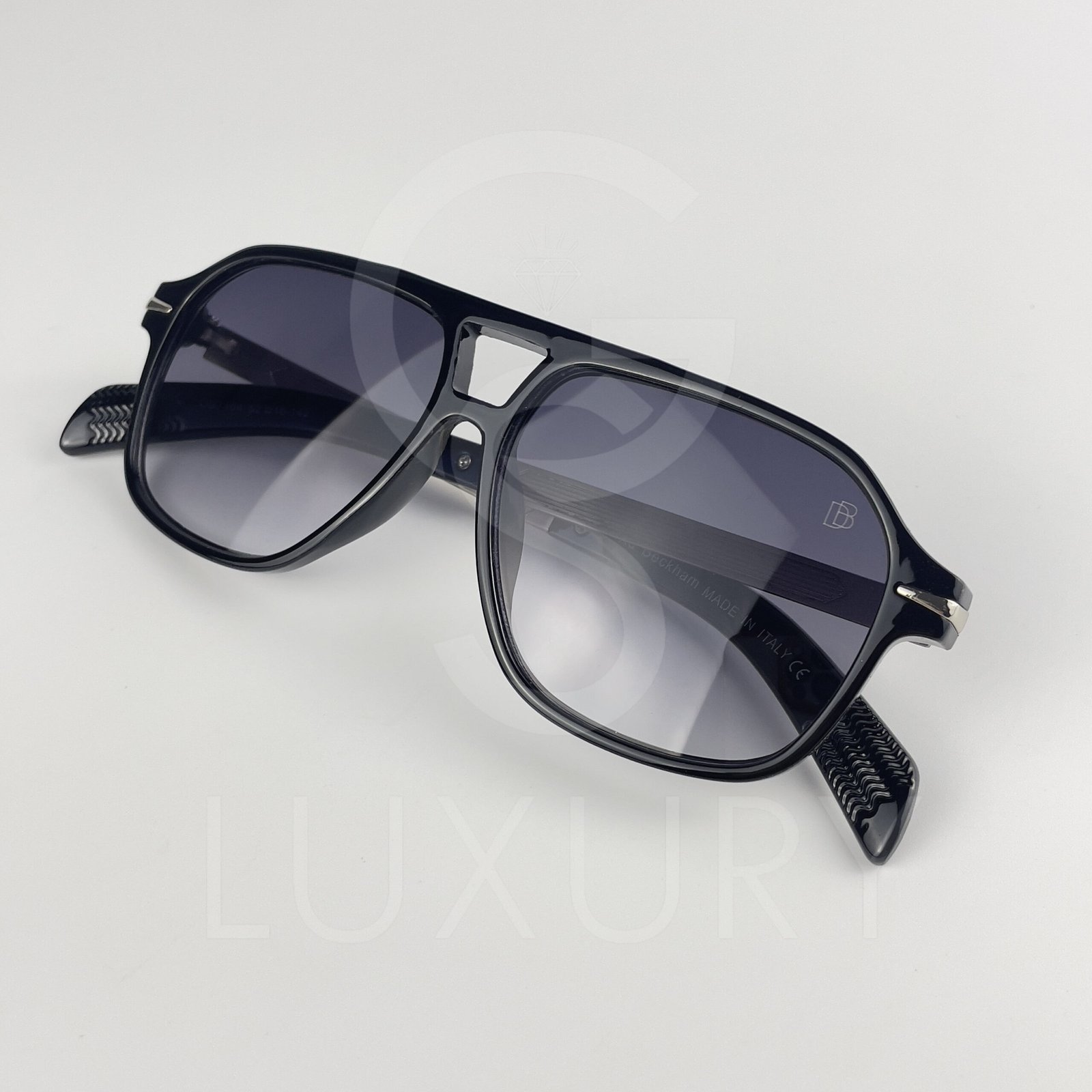 Lunette de soleil David beckham Double pont bras métal Noir glacé Verre Bleu foncé DB7104
